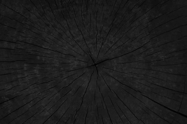 Schwarzer Grunge-Hintergrund aus verbranntem Holz. — Stockfoto