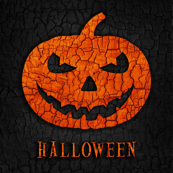Абстрактная тыква к Хэллоуину на фоне фактуры черного выжженного дерева
