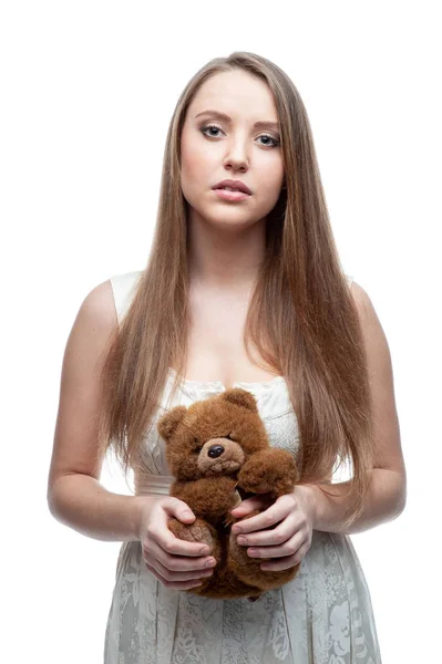 Girl holding a teddy bear. — Stock Photo, Image