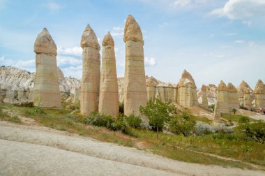 scenic view of fairy chimneys and mountains in valley, Cappadocia, Turkey  clipart