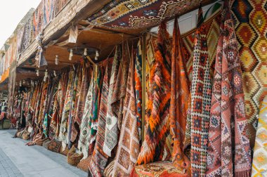 front view of different carpets at market in Cappadocia, Turkey clipart