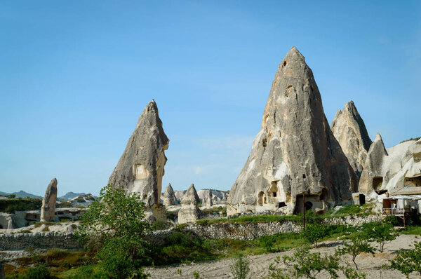 front view of dwellings in stone formations in valley of Cappadocia, Turkey