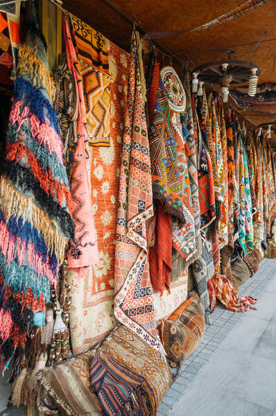close up view of different colorful carpets at market in Cappadocia, Turkey