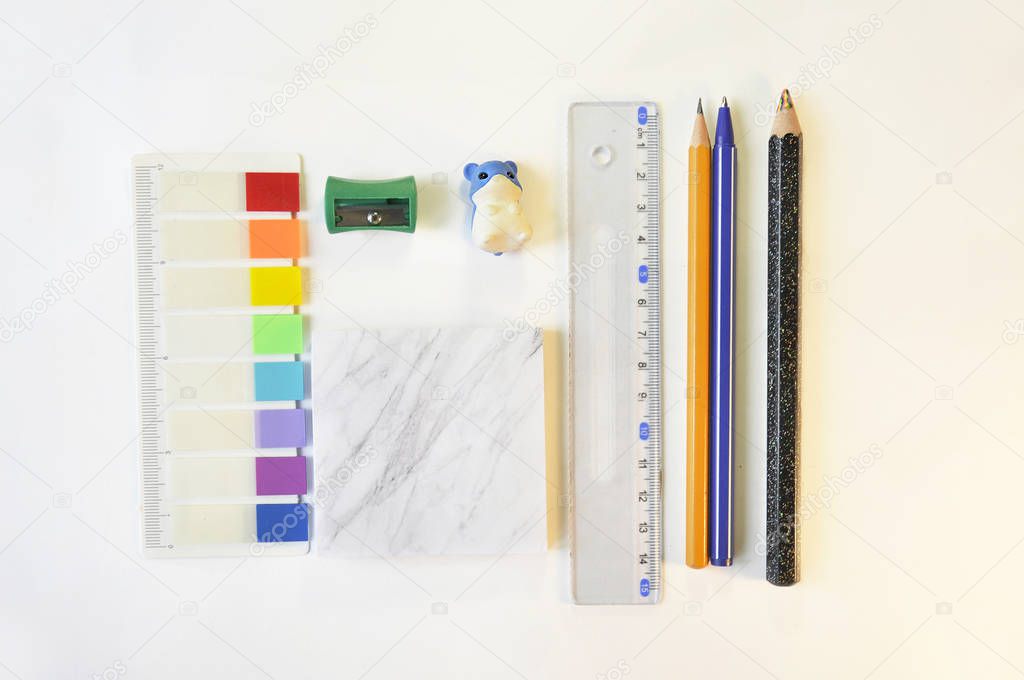 A set of school supplies as ruler, eraser, pen and pecil, bookmarks. Education equipment