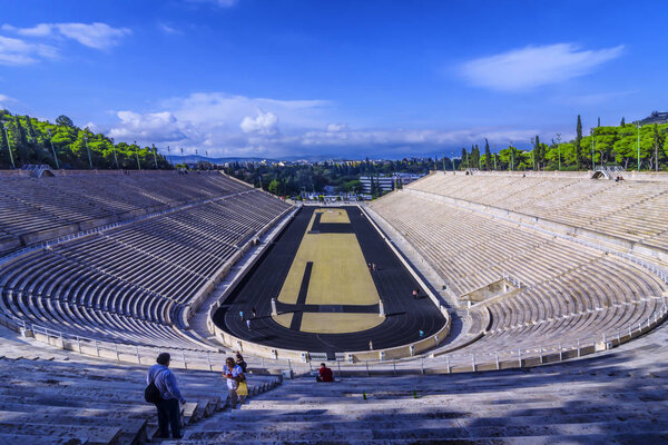 Athens, Attica / Greece. The Panathenaic Stadium or Kallimarmaro. It hosted the opening and closing ceremonies of thefirst modern Olympics in 1896. Sunny day, cloudy blue sky