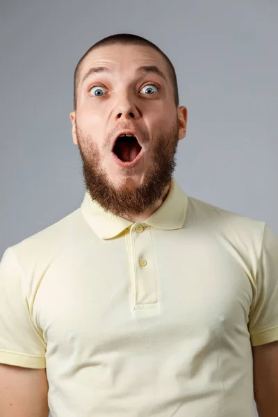 Close Portrait Young Happy Man Yellow Shirt Emotions Gray Background — Stock Photo, Image