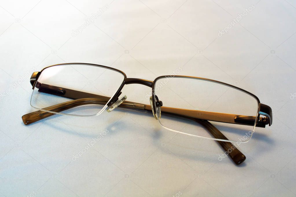 Reading glasses on a white background