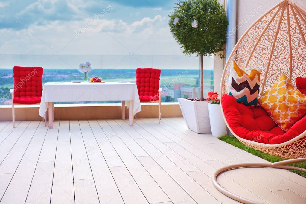 relaxing furnished area on roof top patio area at warm summer day