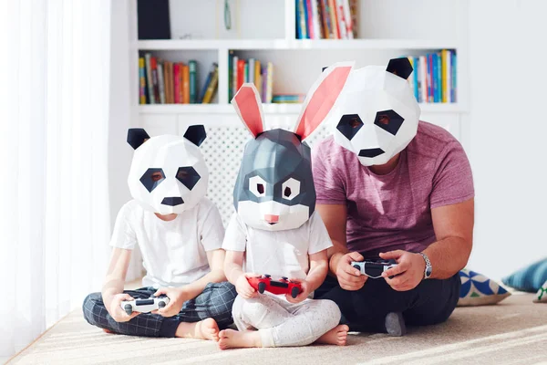 concept image of family in polygonal animal masks playing games