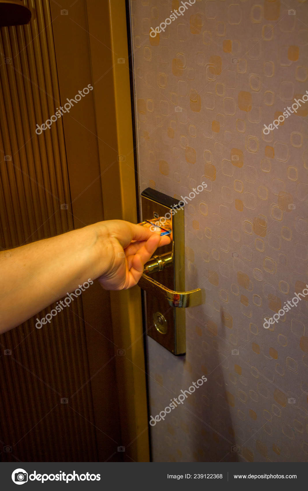 Hand Inserting Key Card Hotel Room Electronic Door Security