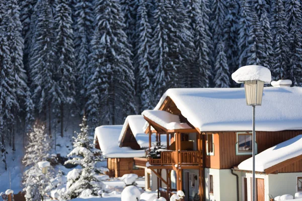 Winter holiday houses covered with a snow. Austrian alps