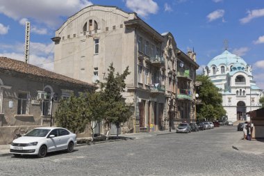 Evpatoria, Crimea - July 4, 2018: Landscape of Summer Alley overlooking Duvan's house and St. Nicholas Cathedral in the city of Evpatoria, Crimea