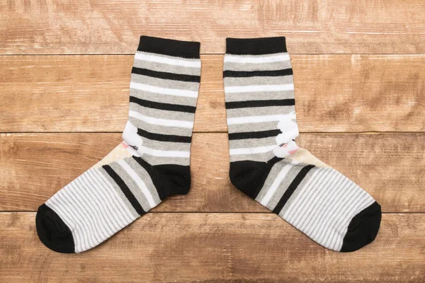 Socks  on a wooden background.