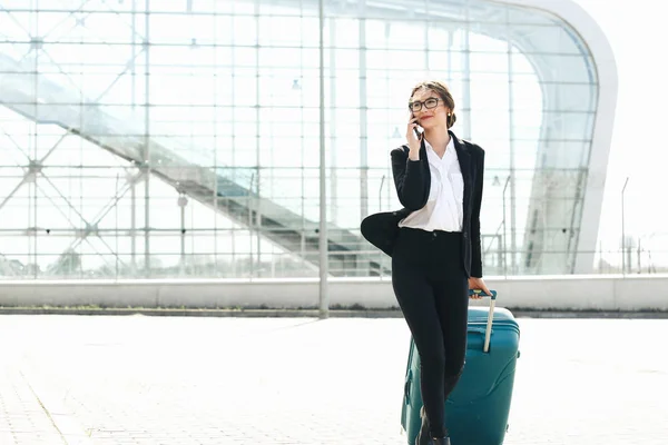 Business woman at international airport moving to terminal gate for airplane travel trip - Mobility concept and aerospace industry flight connections