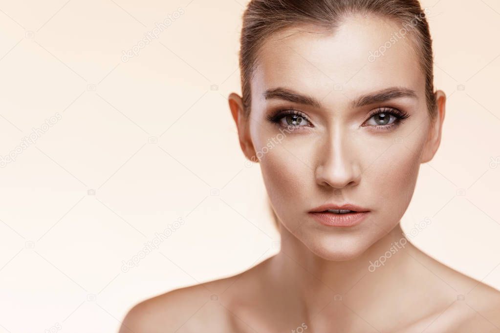 Beautiful Young Girl With Perfect Skin On Beige Background. Skin Care Concept 