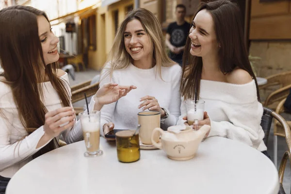 Girlfriends have fun in cafe — Stock Photo, Image
