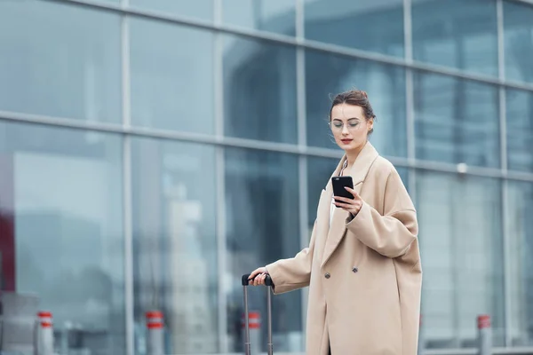 . Business woman at international airport moving to terminal gate for airplane travel trip - Mobility concept and aerospace industry flight connections