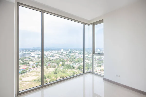 The glass balcony overlooks the sea.