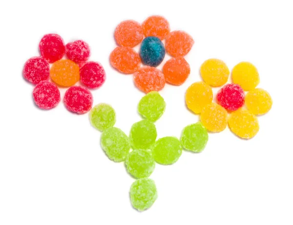 Komposition Mehrfarbiger Süßigkeiten Form Von Drei Blumen Auf Isoliertem Weißem — Stockfoto