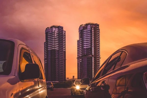 Orange sunset over the city. Bright sky. Evening twilight.