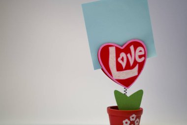 St. Valentine's Day. Red wooden heart with the inscription 
