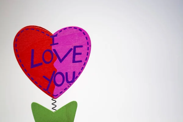 St. Valentine's Day. Red wooden heart with the inscription 