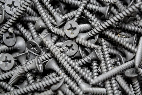 Doku. Arka plan. Gri renk. Bu aynı yeni çivi ortalama büyüklükte bir sürü var. İnşaat malzemeleri. Onarım.