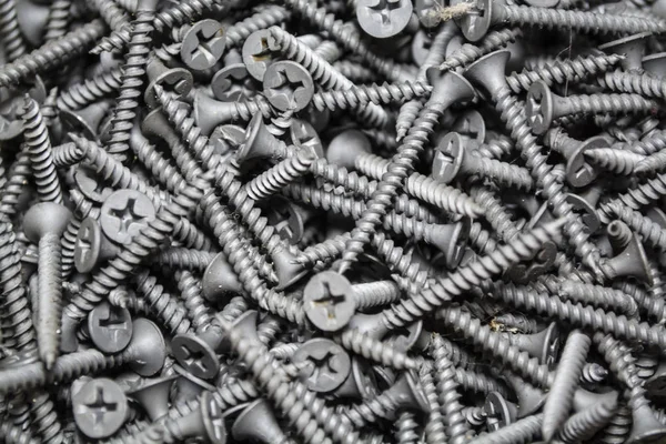 Doku. Arka plan. Gri renk. Bu aynı yeni çivi ortalama büyüklükte bir sürü var. İnşaat malzemeleri. Onarım.