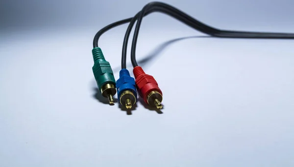 Multimedia multi-colored cables. Or tulips adapters for audiodevices. On a white background. The isolated object.