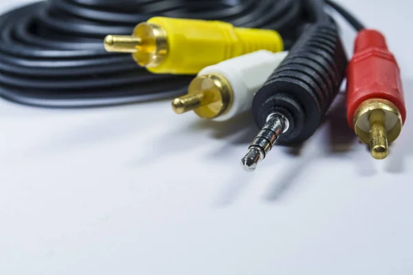 Hank of multi-colored plugs. Adapter. Tulips adapters for audiodevices. On a white background. The isolated object. For TV and PC.