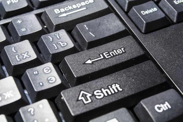 Black computer keyboard. Button enter close up. Modern equipment. Computer. Buttons. Background and texture. — Stock Photo, Image