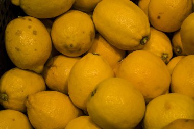 Arka plan veya doku limon sarı renk üzerinden. Vitamin ve meyve, narenciye. Sağlıklı yaşam ve yemek. Suyu için temel.