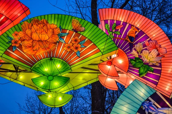 Various bright Chinese small lamps in the park. Garland. An unusual decor for streets and the house. Festive mood — Stock Photo, Image