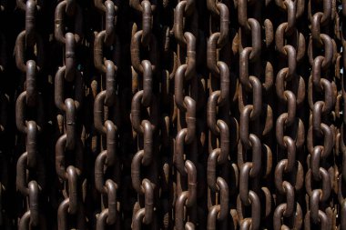 Background or texture from big metal and rusty chains and links. clipart