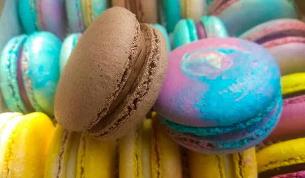 Background or texture of bright and multicolored French desserts. Macaron. Cookies. Sweets.