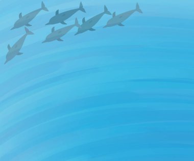 Yunuslar denizde yüzüyor.