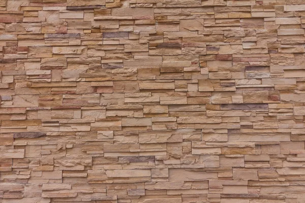 Gele stenen stenen muur textuur achtergrond — Stockfoto