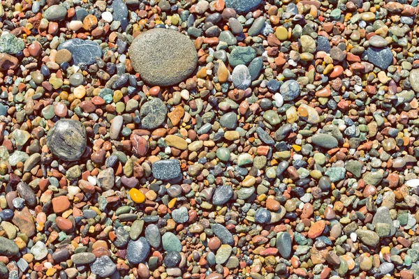 Αφηρημένη Πολύχρωμο βότσαλα φόντο. Όμορφη πολύχρωμη υφή βότσαλα. Πολύχρωμο φόντο πέτρα στη θάλασσα. Ιστορικό αφηρημένης φύσης — Φωτογραφία Αρχείου