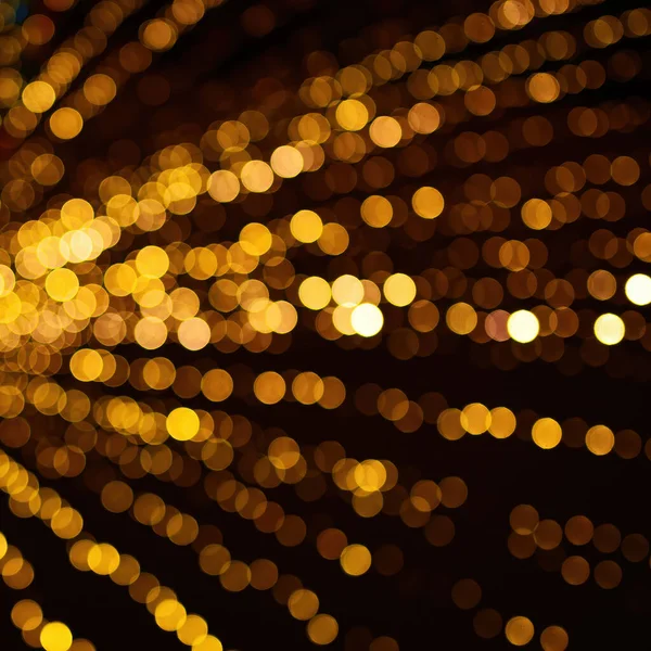 Karácsonyi arany bokeh fények háttér. Defocused karácsonyfa dekoráció háttér — Stock Fotó