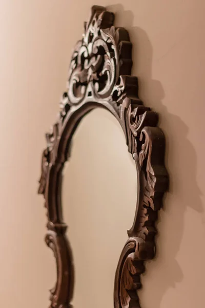 a perspective shoot to antique mirror with brown frame.