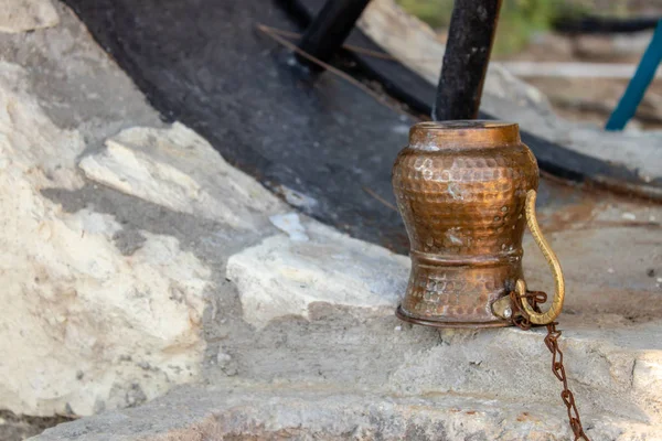 Bronze Water Pitcher Closeup Shoot Stone Water Noir Photo Has — Stock Photo, Image