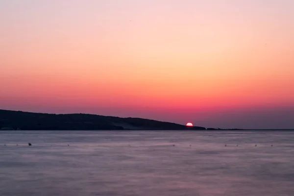 iyi ile gün batımında deniz uzun pozlama geniş manzara ateş 