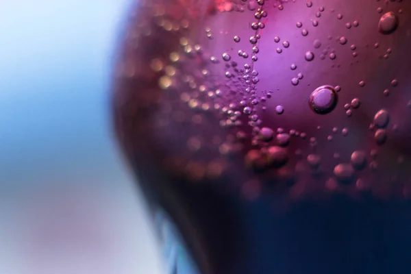 Air bubbles on a piece of ice in a soda liquid. Soda, water, bubbles, ice, texture, glass, glass, curve,