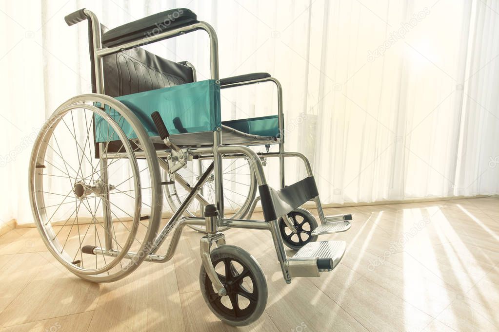 Wheelchair parking in the hospital room with sunlight in background, concept for the health care of elderly or the disabled.