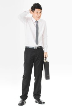 Orta yaşlı tam uzunlukta portresi, yakışıklı, Asya, işadamı, Beyaz gömlekli ti çizgili.