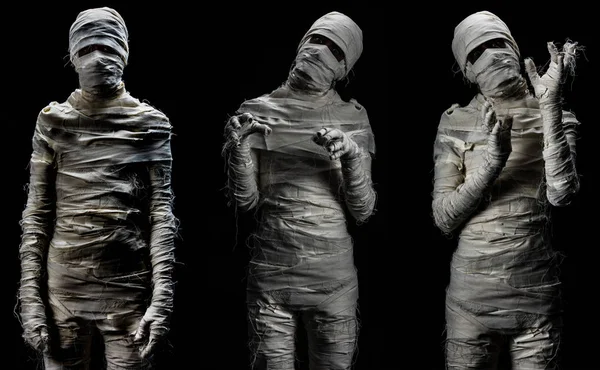 Siyah arka plan üzerinde çeşitli şekillerde poz korkunç mumya cosplay gibi giyinmiş kostüm genç adamın stüdyo çekim portre seti.