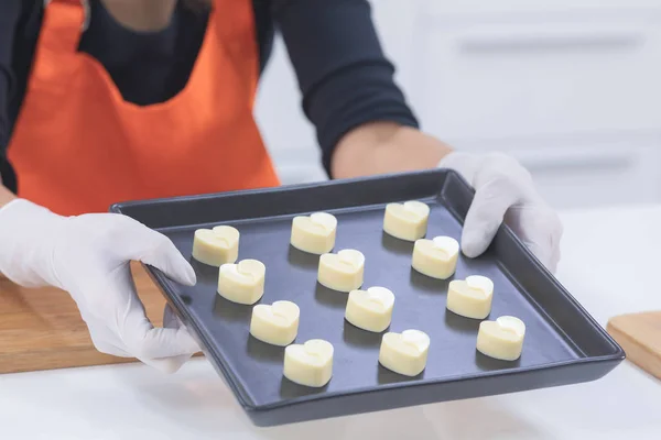 white heart chocolate in box hold by woman