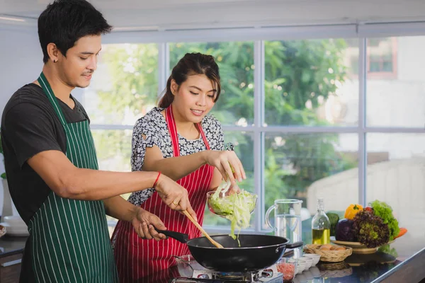 Asian couple at kitchen room — Stock Photo, Image