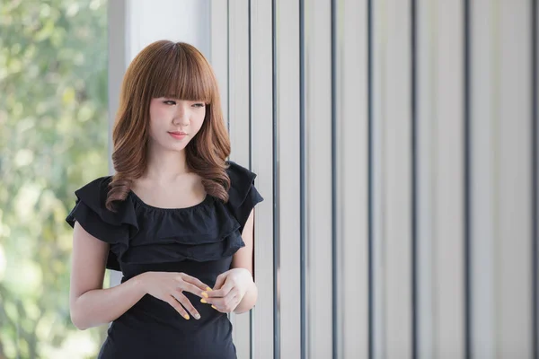 Young lady in black dress — Stock Photo, Image