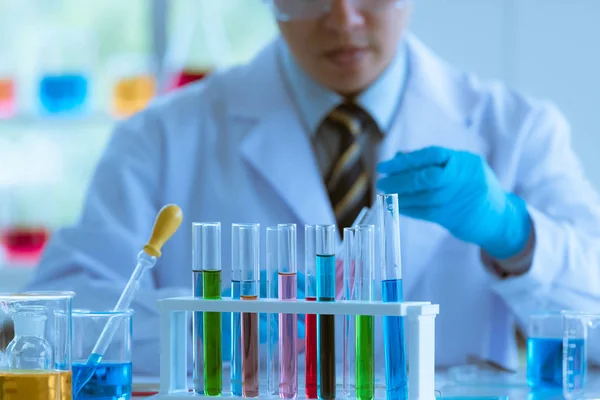 Male scientist collecting experimental samples. Stock Photo